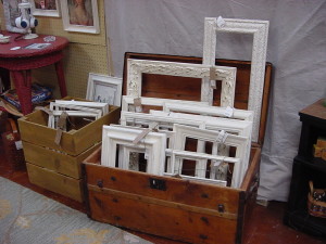 Trunk Filled With Distressed Picture Frames